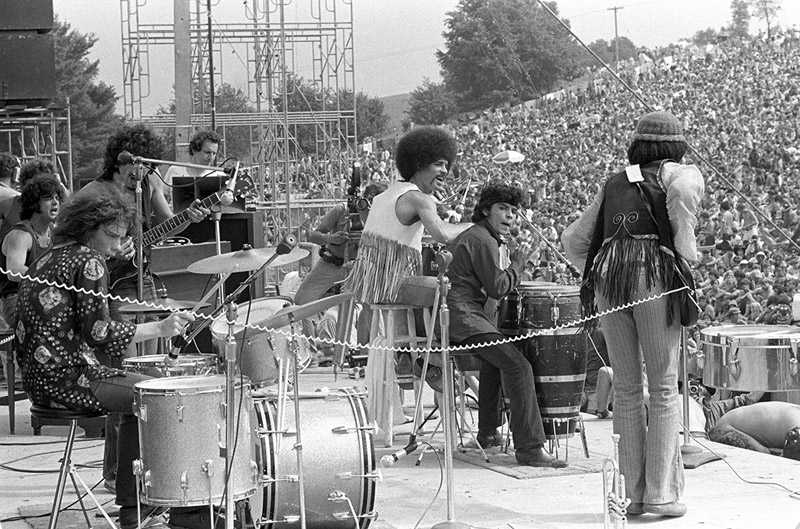 Carlos Santana and band on Stage at Woodstock Music & Art Fair